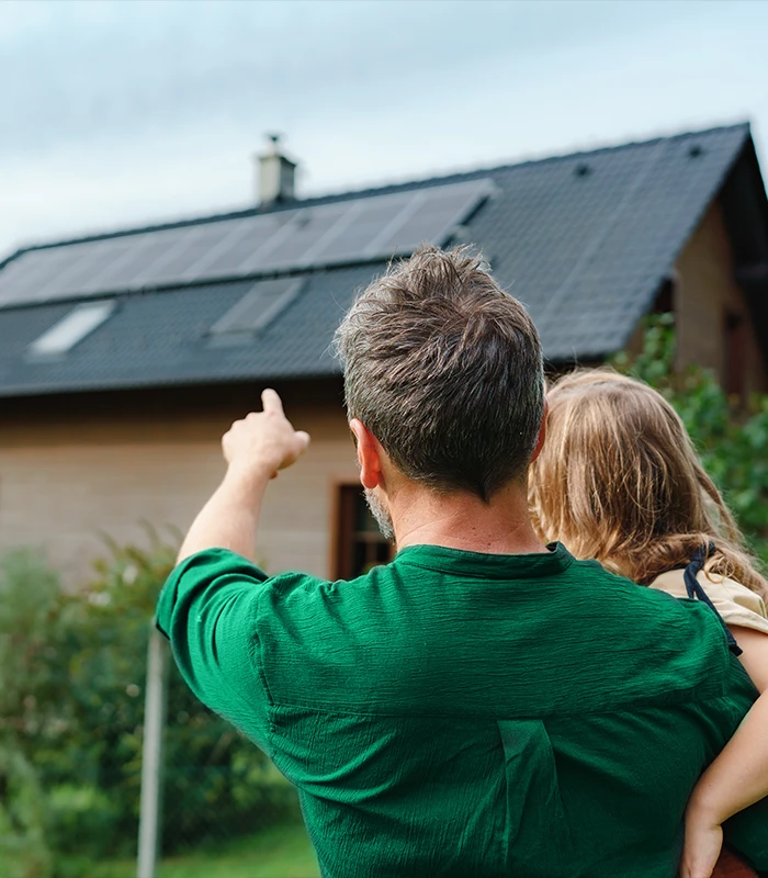 Father showing his daughter the new solar panels