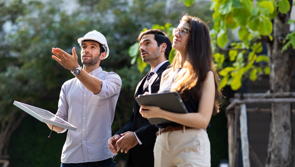 Solar installer explaining benefits of technology to family