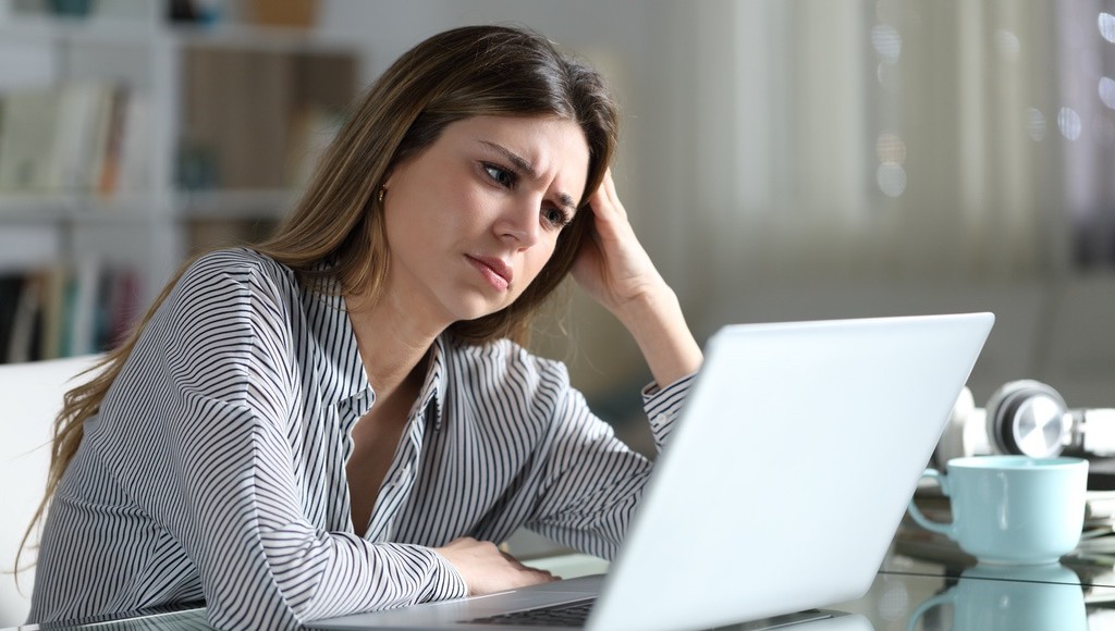 Woman at laptop frustrated by underperforming educational content