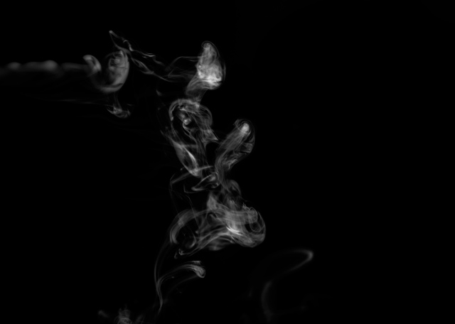 Vaoe smoke rising in black and white image